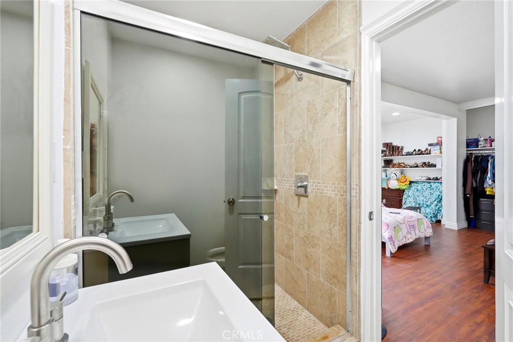 8630 Sharp Avenue Sun Valley, CA 91352 - Photo 36 of 62 a bathroom with a sink and a mirror