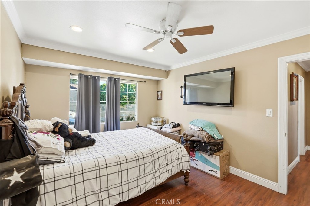 8630 Sharp Avenue Sun Valley, CA 91352 - Photo 39 of 62 a bedroom with a bed and wooden floor