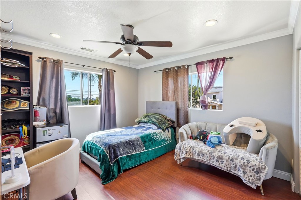 8630 Sharp Avenue Sun Valley, CA 91352 - Photo 43 of 62 a bedroom with a bed couch and a window