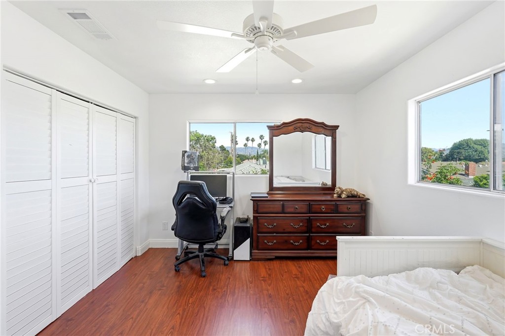 8630 Sharp Avenue Sun Valley, CA 91352 - Photo 45 of 62 a room with furniture and wooden floor