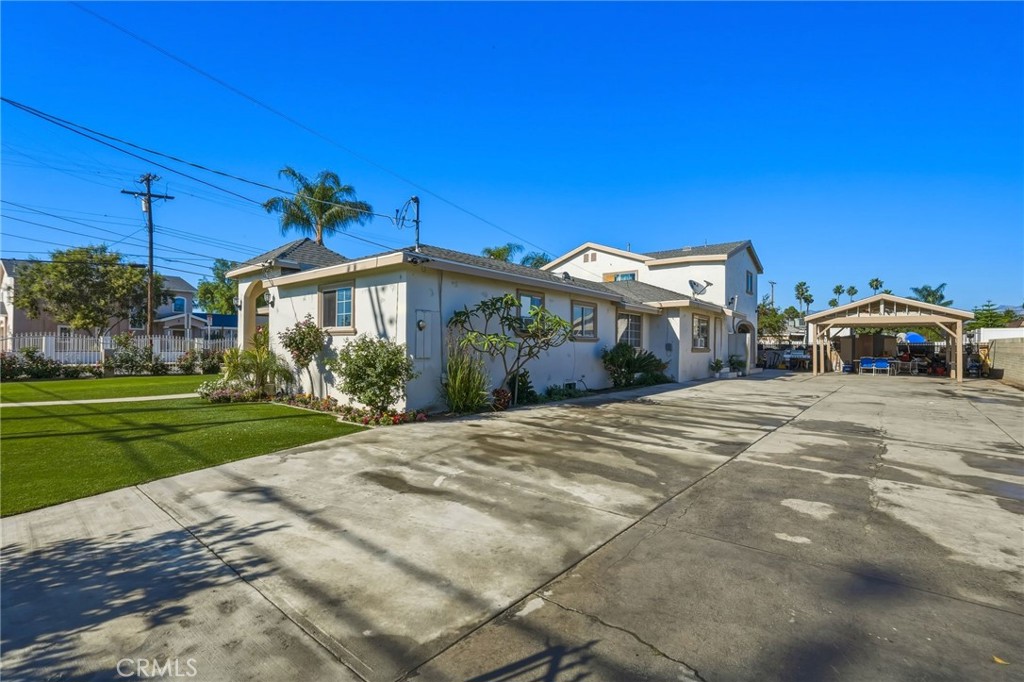 8630 Sharp Avenue Sun Valley, CA 91352 - Photo 46 of 62 a front view of a house with a yard