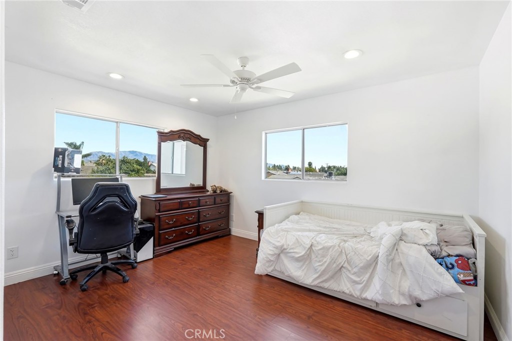 8630 Sharp Avenue Sun Valley, CA 91352 - Photo 50 of 62 a bedroom with furniture and a wooden floor