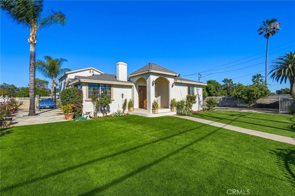 8630 Sharp Avenue Sun Valley, CA 91352 - Photo 53 of 62 a front view of a house with a yard