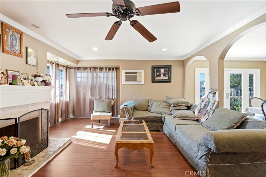 8630 Sharp Avenue Sun Valley, CA 91352 - Photo 6 of 62 a living room with furniture a fireplace and a chandelier