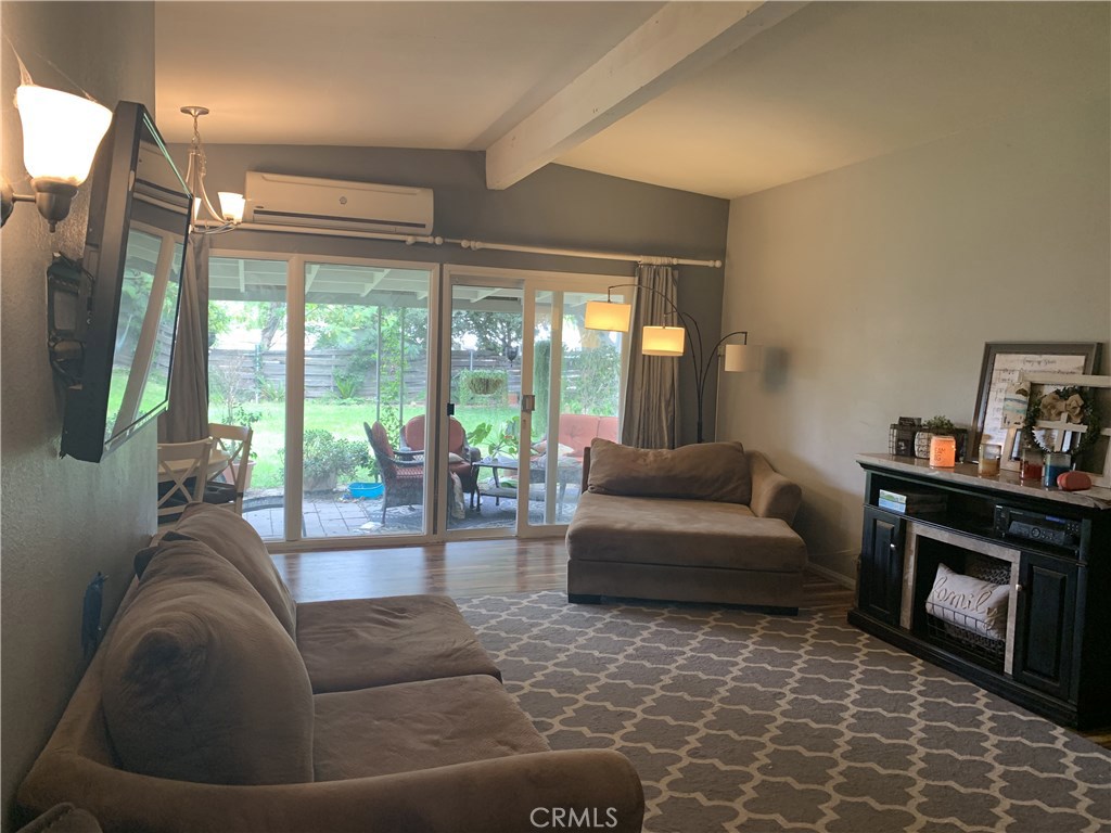 4259 Canterbury Road Riverside, CA 92504 - Photo 1 of 1 a living room with furniture and a fireplace