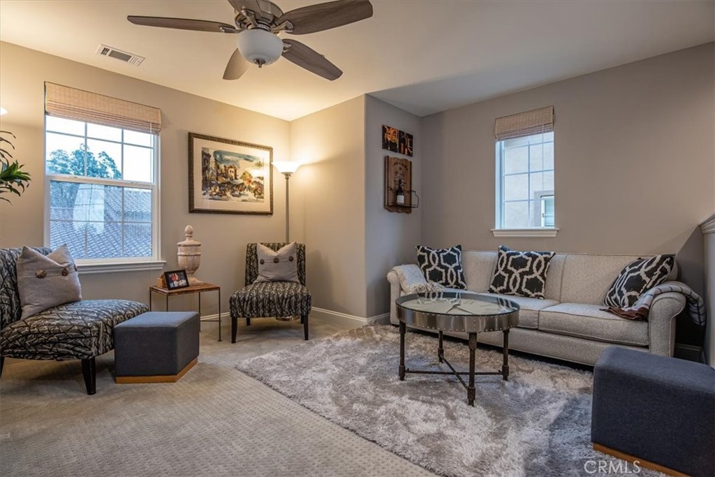 1170 Spring Azure Way, Unit 45 Nipomo, CA 93444 - Photo 13 of 43 a living room with furniture and a window