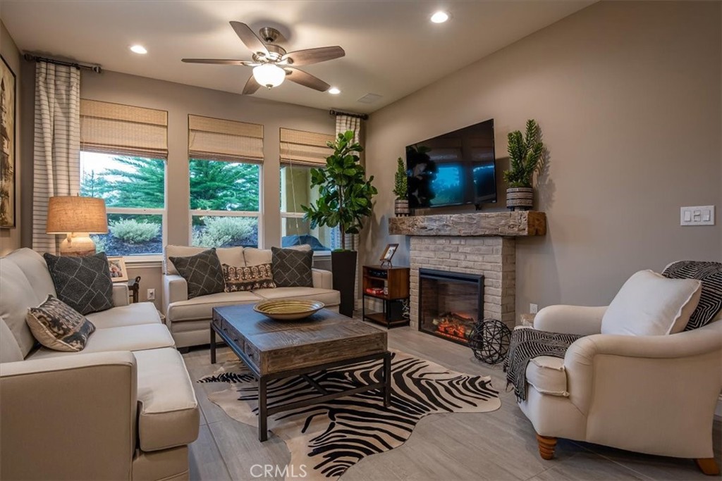 1170 Spring Azure Way, Unit 45 Nipomo, CA 93444 - Photo 2 of 43 a living room with furniture and a fireplace