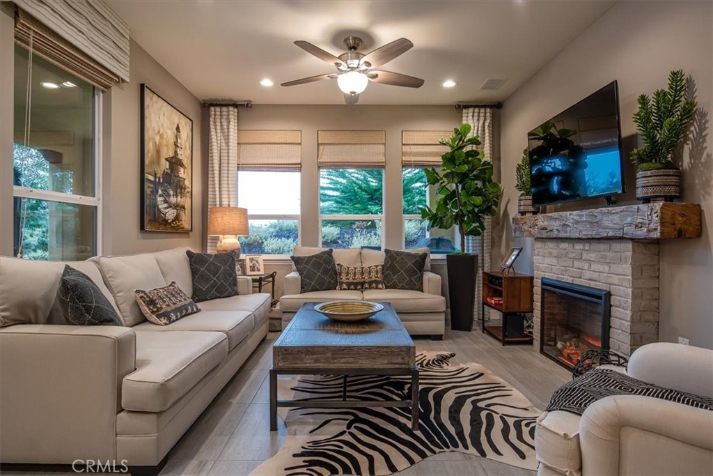 1170 Spring Azure Way, Unit 45 Nipomo, CA 93444 - Photo 3 of 43 a living room with furniture fireplace and flat screen tv