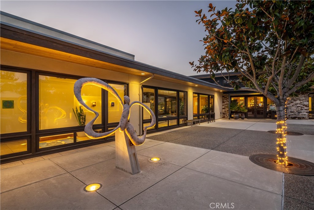 1170 Spring Azure Way, Unit 45 Nipomo, CA 93444 - Photo 41 of 43 a roof deck with table and chairs and potted plants