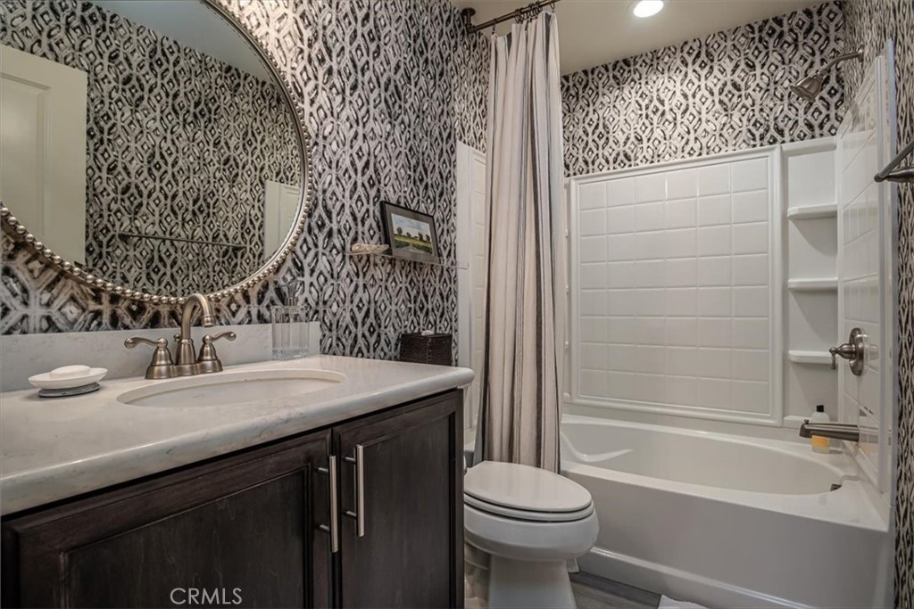 1170 Spring Azure Way, Unit 45 Nipomo, CA 93444 - Photo 8 of 43 a bathroom with a sink and a mirror