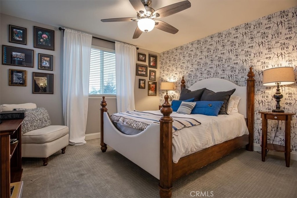 1170 Spring Azure Way, Unit 45 Nipomo, CA 93444 - Photo 9 of 43 a bedroom with a bed and a couch