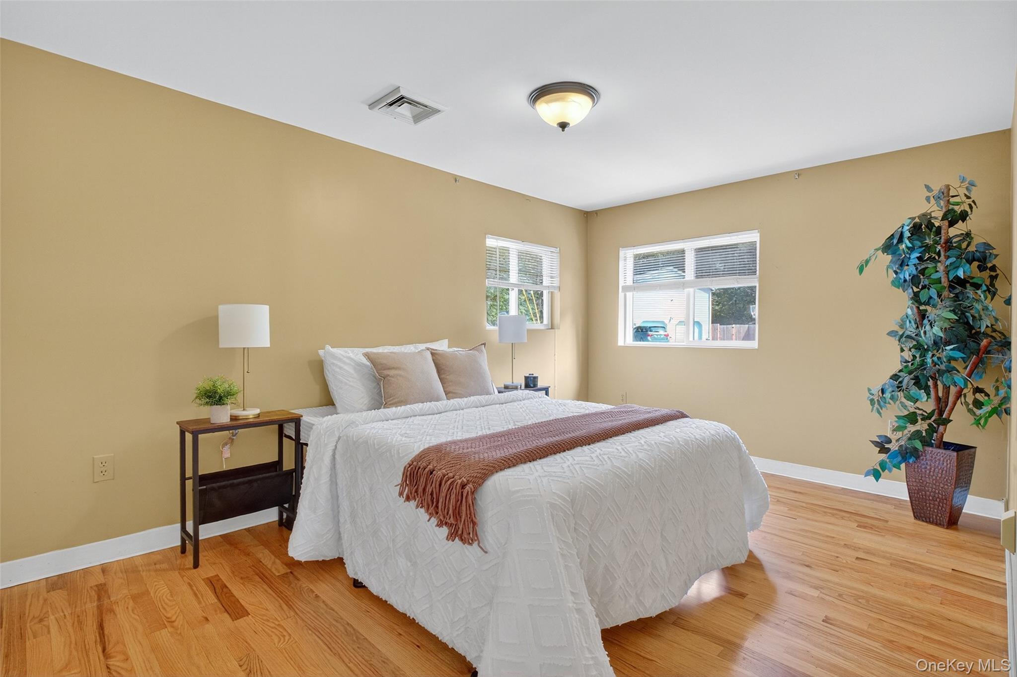 101 Osborne Hill Road Fishkill, NY 12524 - Photo 11 of 19 a spacious bedroom with a bed and a potted plant