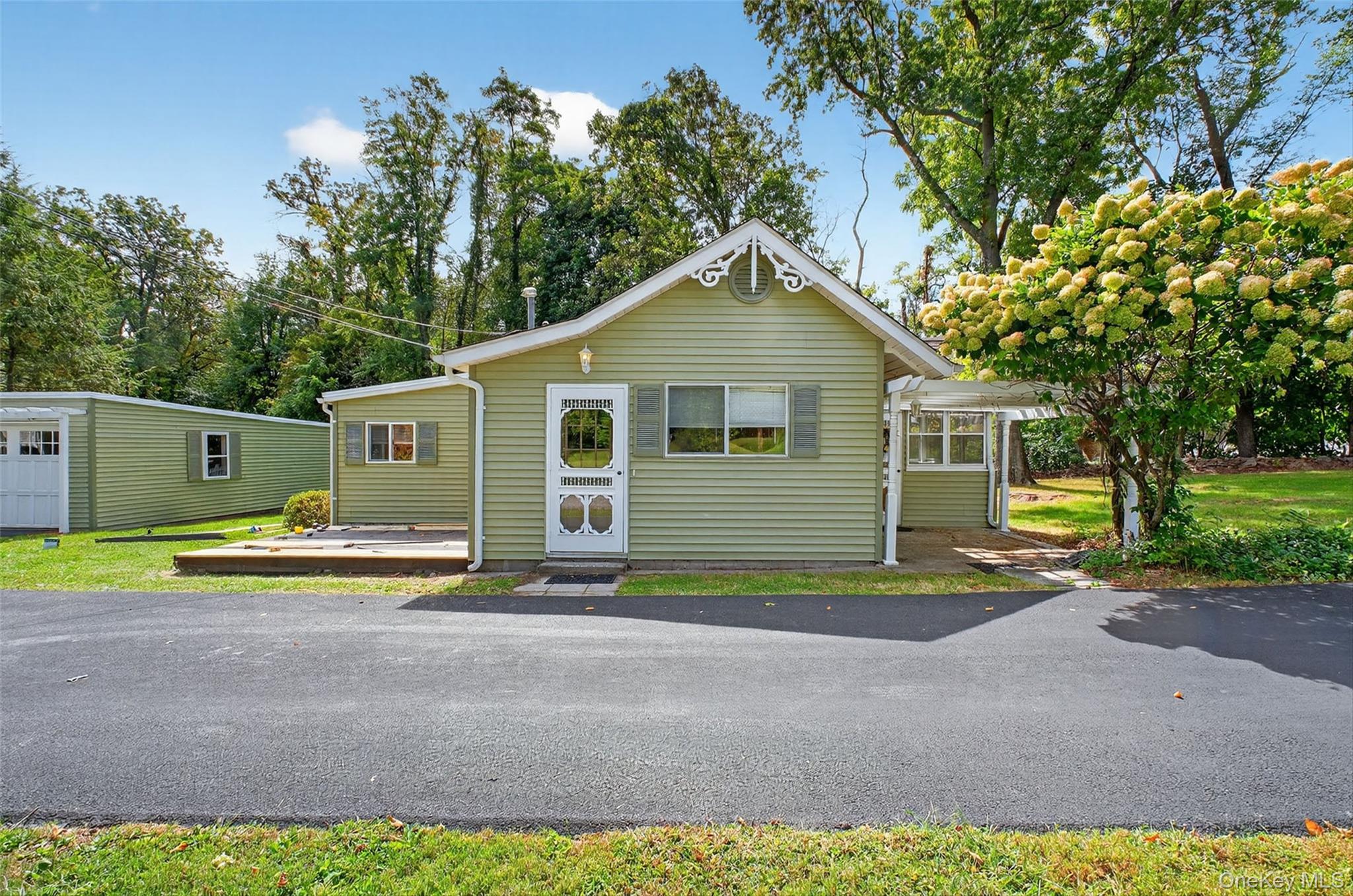 101 Osborne Hill Road Fishkill, NY 12524 - Photo 16 of 19 a view of a house with a backyard and a tree
