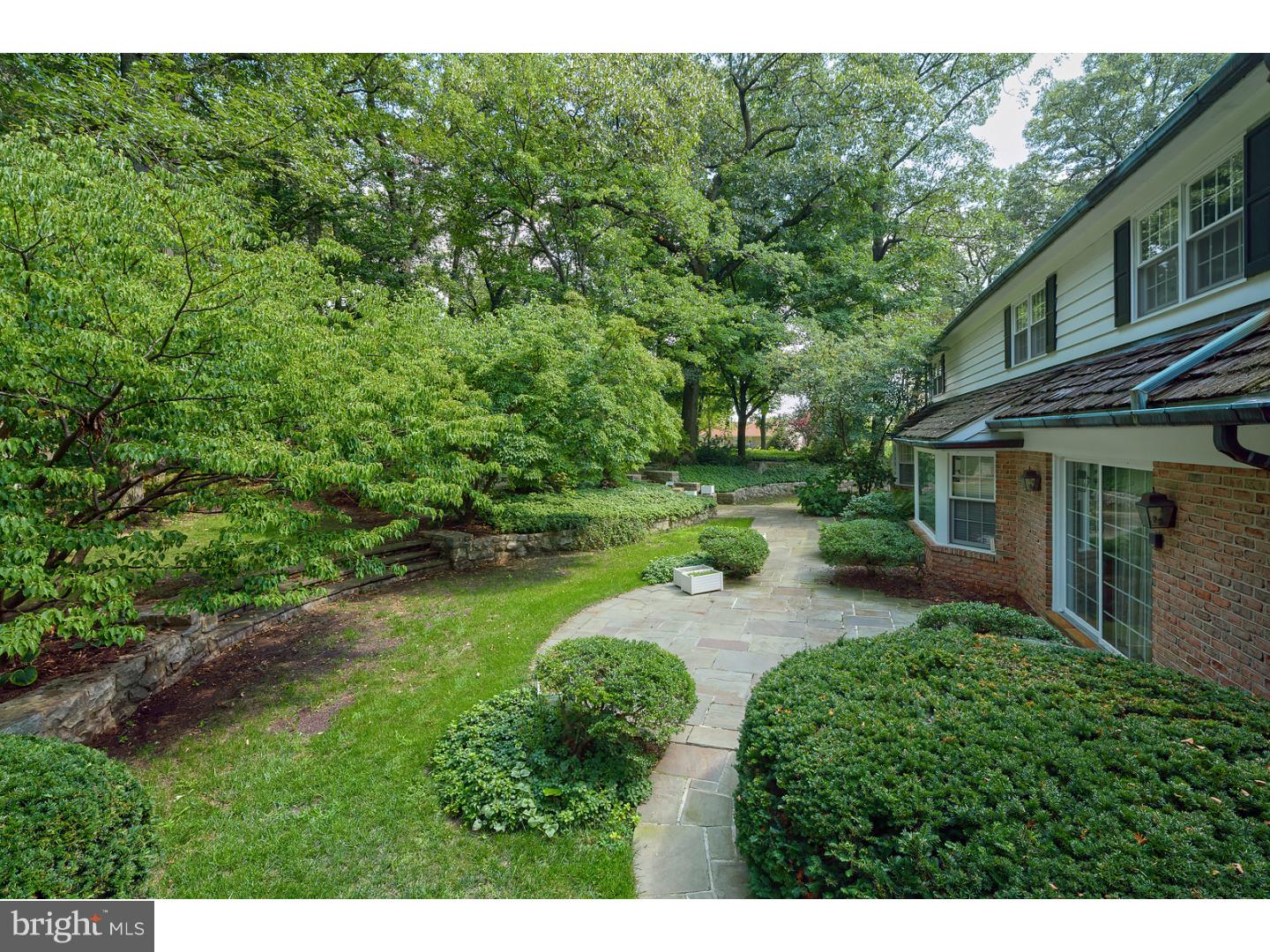 230 Wegman Road Reading, PA 19606 - Photo 23 of 25 a view of backyard of house with outdoor seating and green bushes