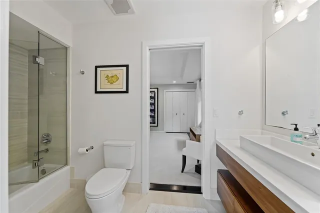 a view of a storage and utility room with a washer dryer