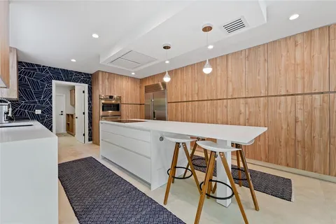 a bathroom with a shower and a sink