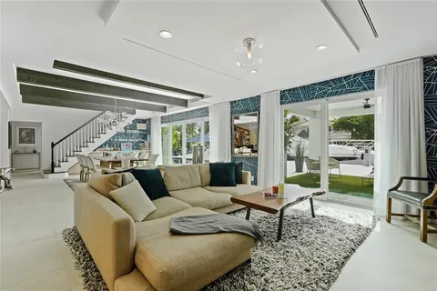 a bathroom with a double vanity sink a mirror and a bathtub