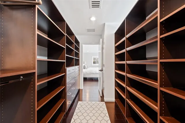 a bathroom with a bathtub shower sink and mirror