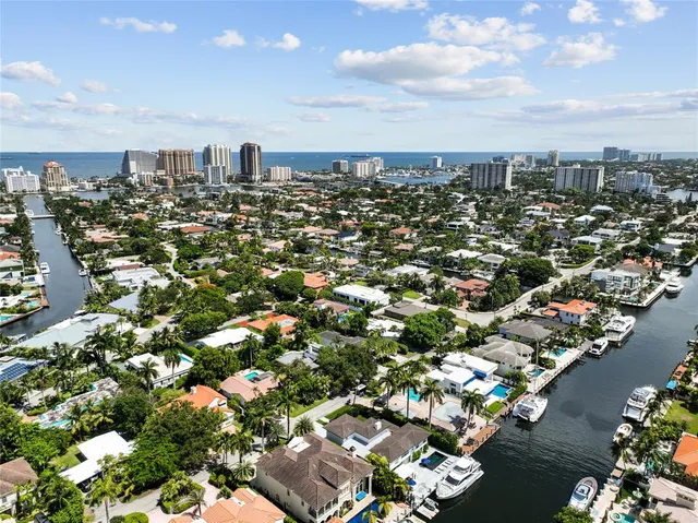 an aerial view of a house with yard swimming pool and outdoor seating