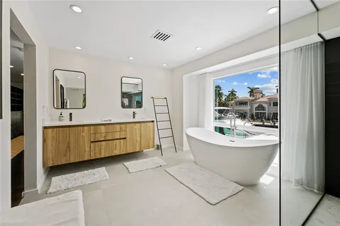 a front view of a house with a garden and yard