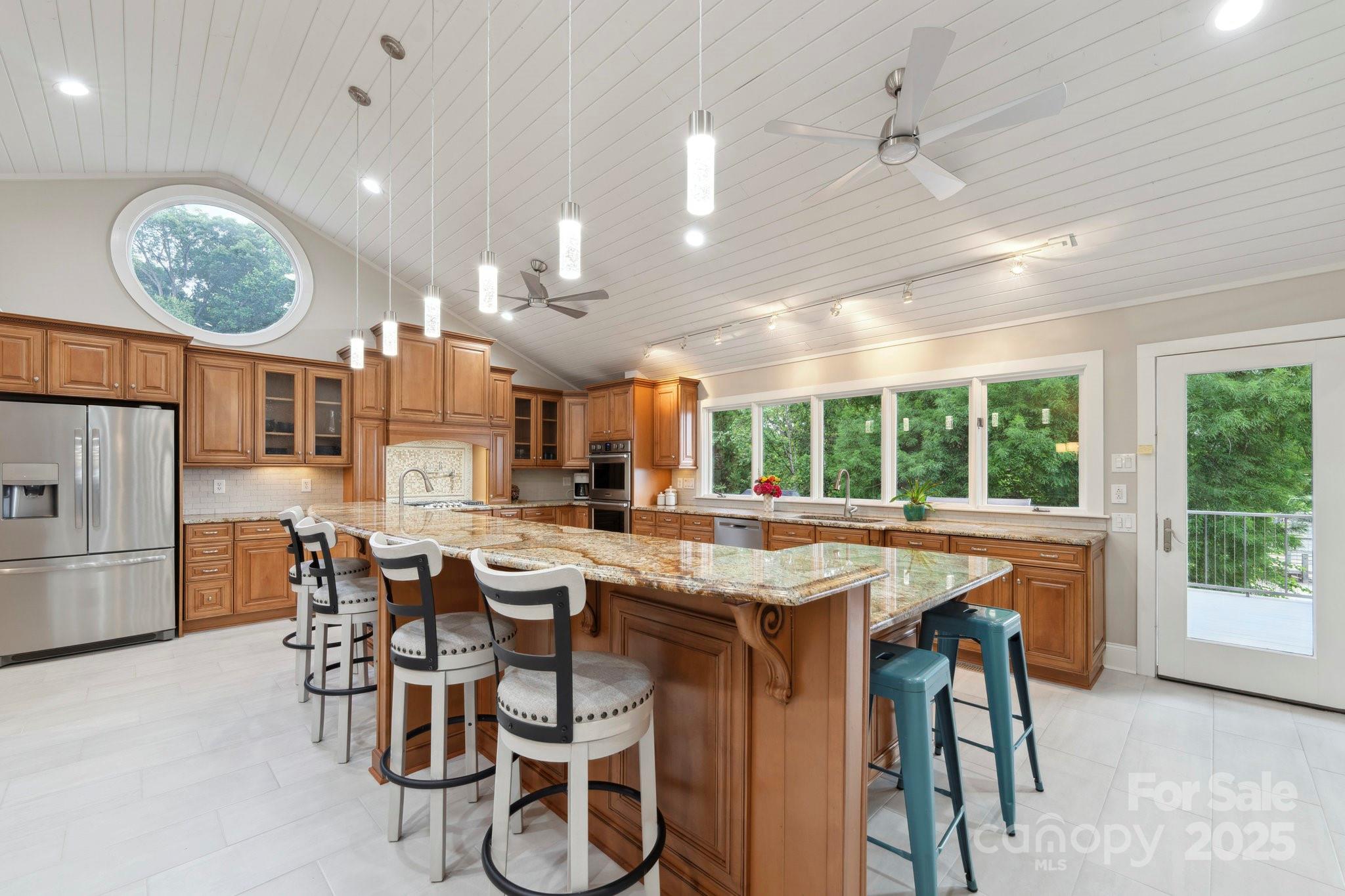 22501 John Gamble Road Cornelius, NC 28031 - Photo 11 of 47 a view of a dining room with furniture window and wooden floor