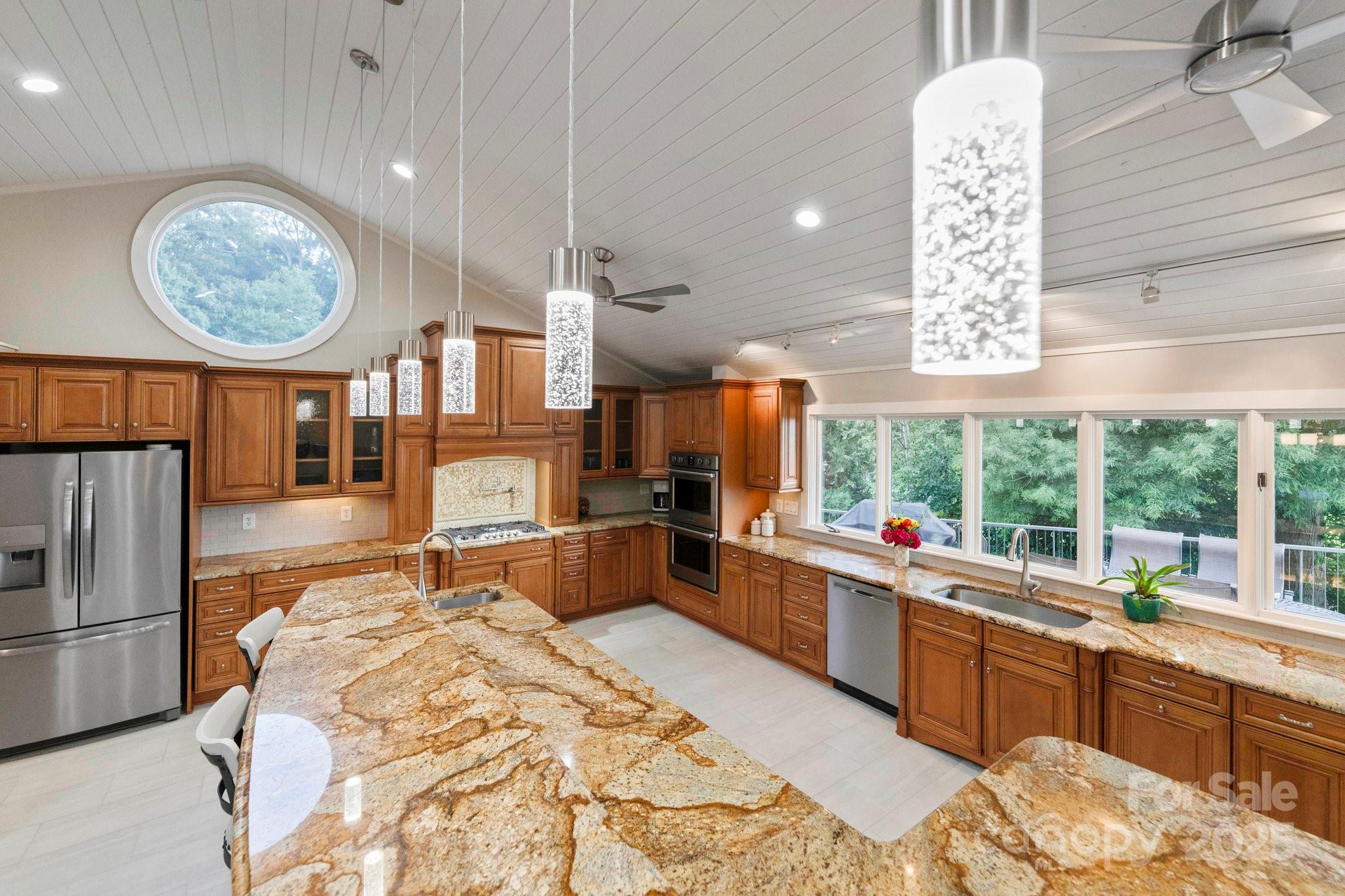22501 John Gamble Road Cornelius, NC 28031 - Photo 18 of 47 a large kitchen with a large window and stainless steel appliances