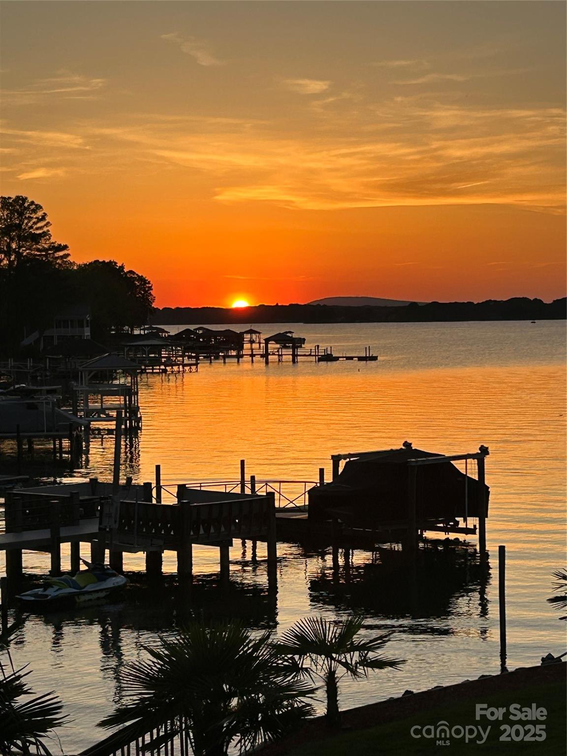22501 John Gamble Road Cornelius, NC 28031 - Photo 2 of 47 a view of a lake with a terrace