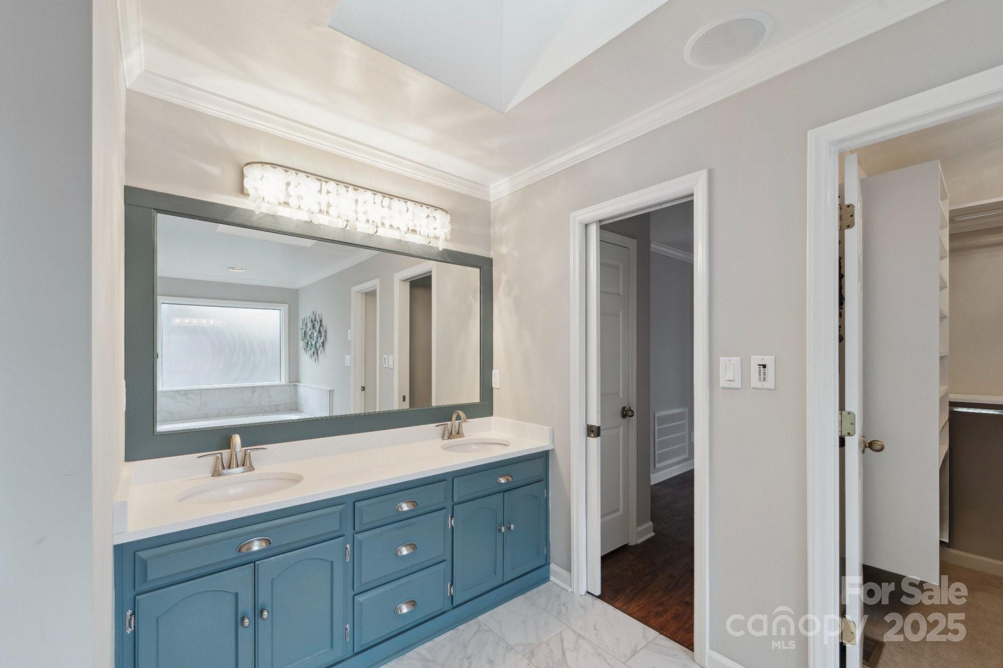 22501 John Gamble Road Cornelius, NC 28031 - Photo 27 of 47 a bathroom with a double vanity sink and a mirror