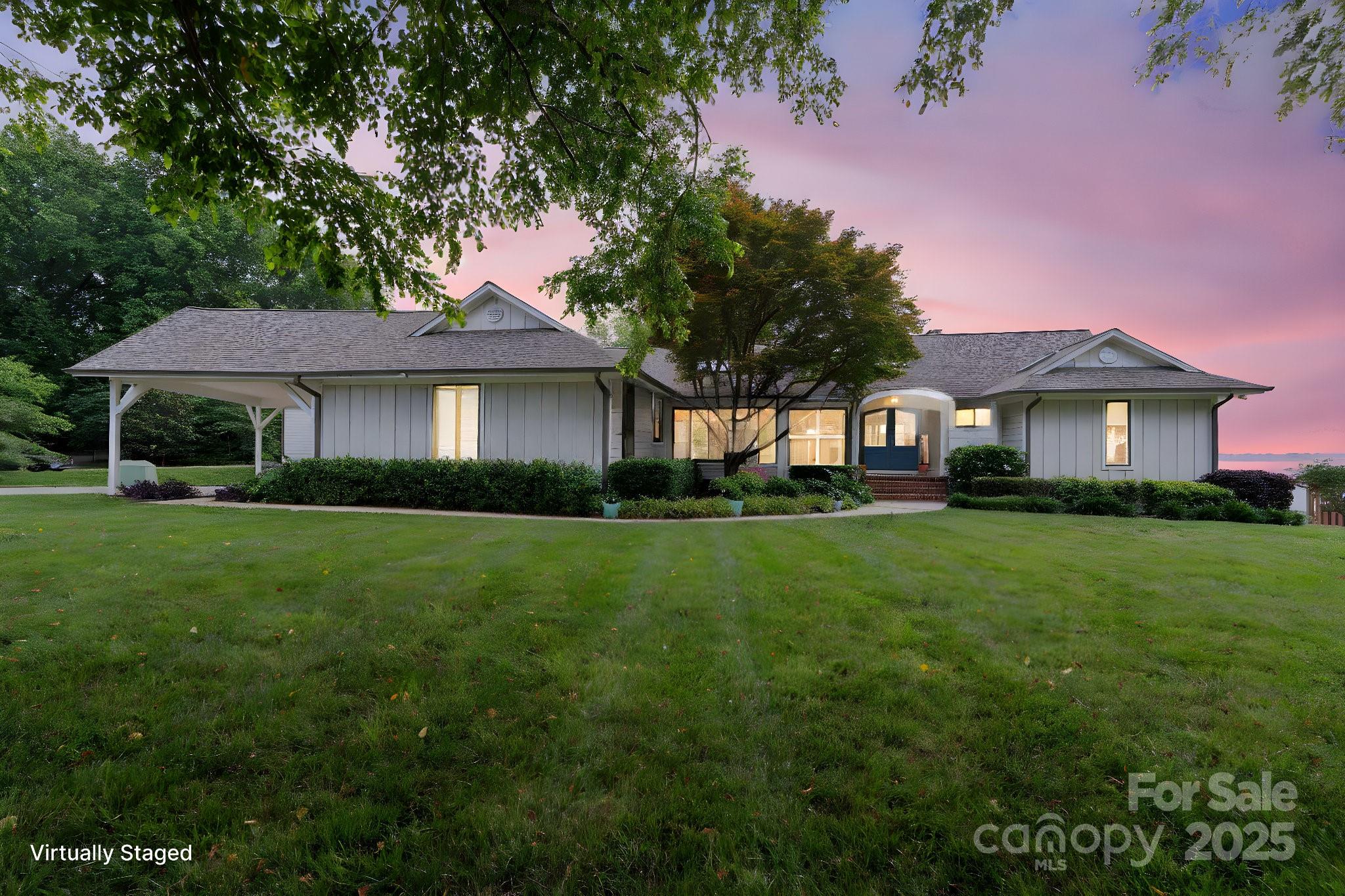 22501 John Gamble Road Cornelius, NC 28031 - Photo 3 of 47 a front view of a house with a garden