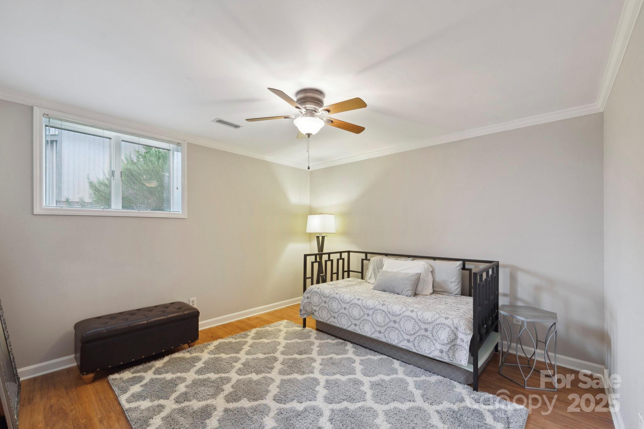22501 John Gamble Road Cornelius, NC 28031 - Photo 33 of 47 a bedroom with a bed and a couch