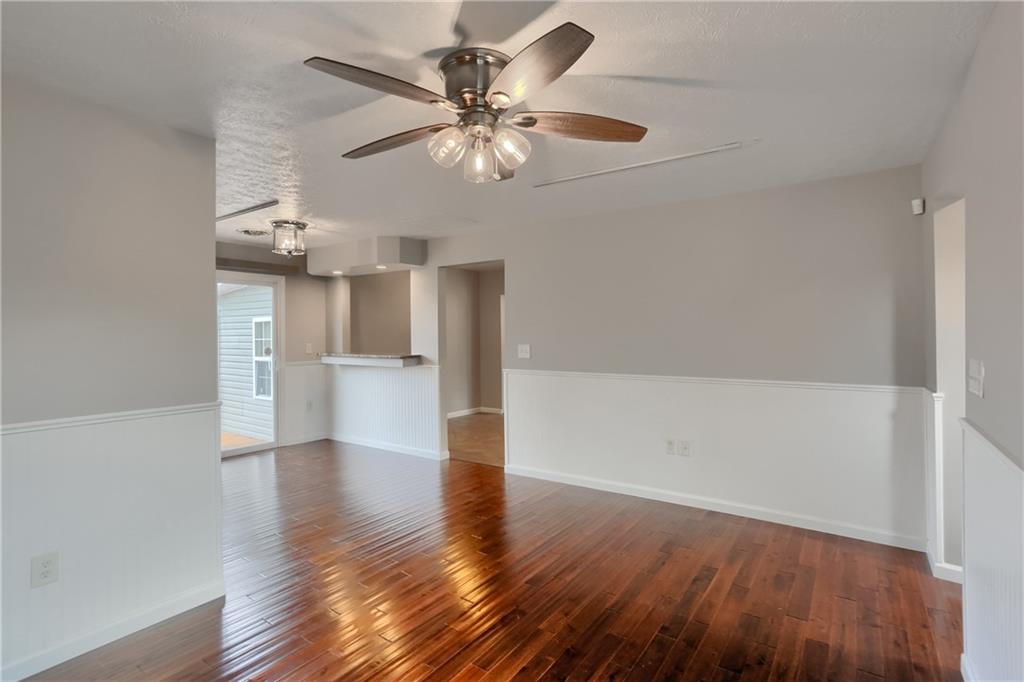110 Oakville Road Beaver Falls, PA 15010 - Photo 11 of 48 a view of an empty room with wooden floor and a ceiling fan