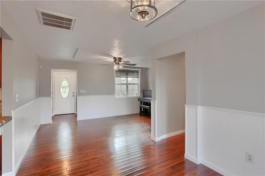 110 Oakville Road Beaver Falls, PA 15010 - Photo 16 of 48 a view of a big room with wooden floor and windows