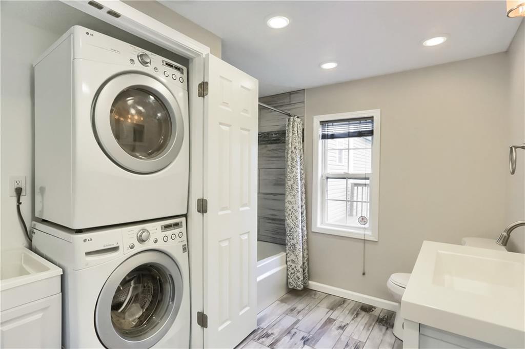 110 Oakville Road Beaver Falls, PA 15010 - Photo 28 of 48 a view of a hallway with washer and dryer