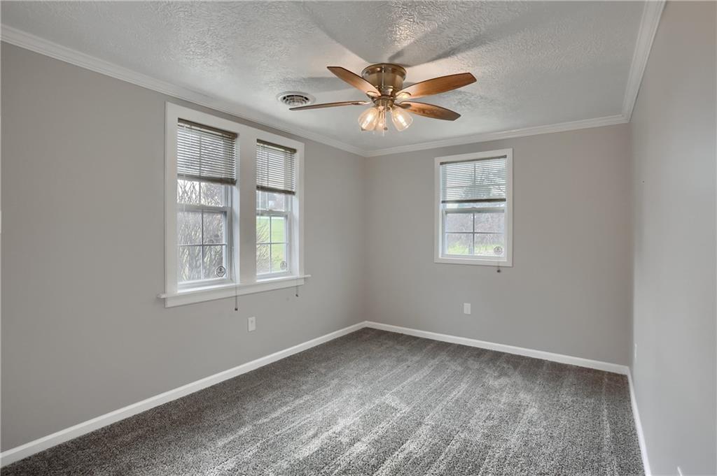 110 Oakville Road Beaver Falls, PA 15010 - Photo 32 of 48 a view of a livingroom with a ceiling fan and window
