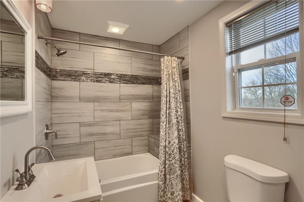 110 Oakville Road Beaver Falls, PA 15010 - Photo 35 of 48 a bathroom with a shower and a toilet