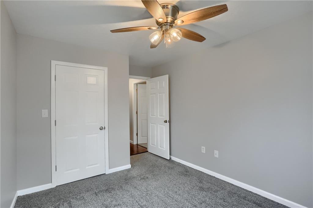 110 Oakville Road Beaver Falls, PA 15010 - Photo 39 of 48 an empty room with a fan and a fan