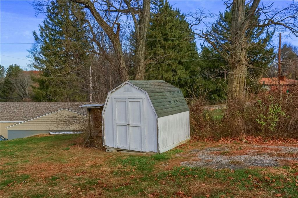 110 Oakville Road Beaver Falls, PA 15010 - Photo 47 of 48 a view of a wooden house with a small yard and large tree