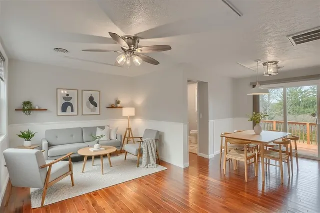 a view of a dining room with furniture window and wooden floor