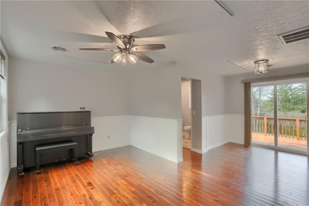 110 Oakville Road Beaver Falls, PA 15010 - Photo 9 of 48 wooden floor in an empty room with a window