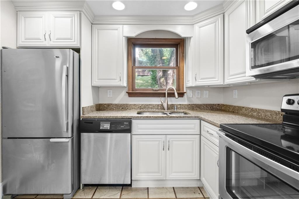 1003 Beacon Way Pittsburgh, PA 15241 - Photo 12 of 45 a kitchen with white cabinets white stainless steel appliances and sink