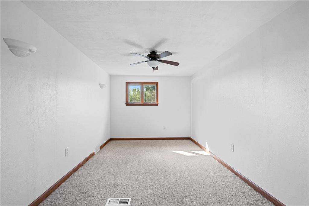 1003 Beacon Way Pittsburgh, PA 15241 - Photo 17 of 45 an empty room with a window and a fan