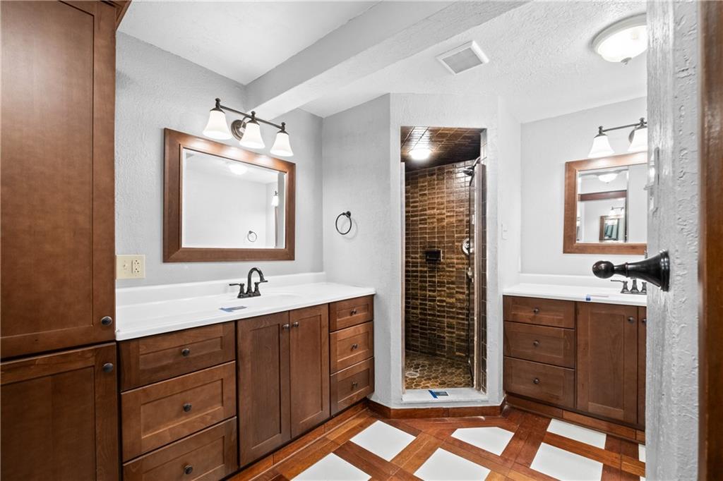 1003 Beacon Way Pittsburgh, PA 15241 - Photo 18 of 45 a bathroom with a double vanity sink a large mirror a shower and