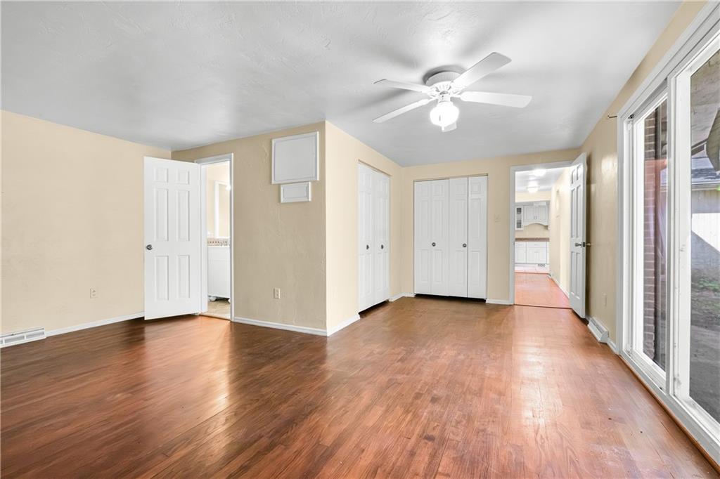 1003 Beacon Way Pittsburgh, PA 15241 - Photo 23 of 45 a view of an empty room with wooden floor and a ceiling fan