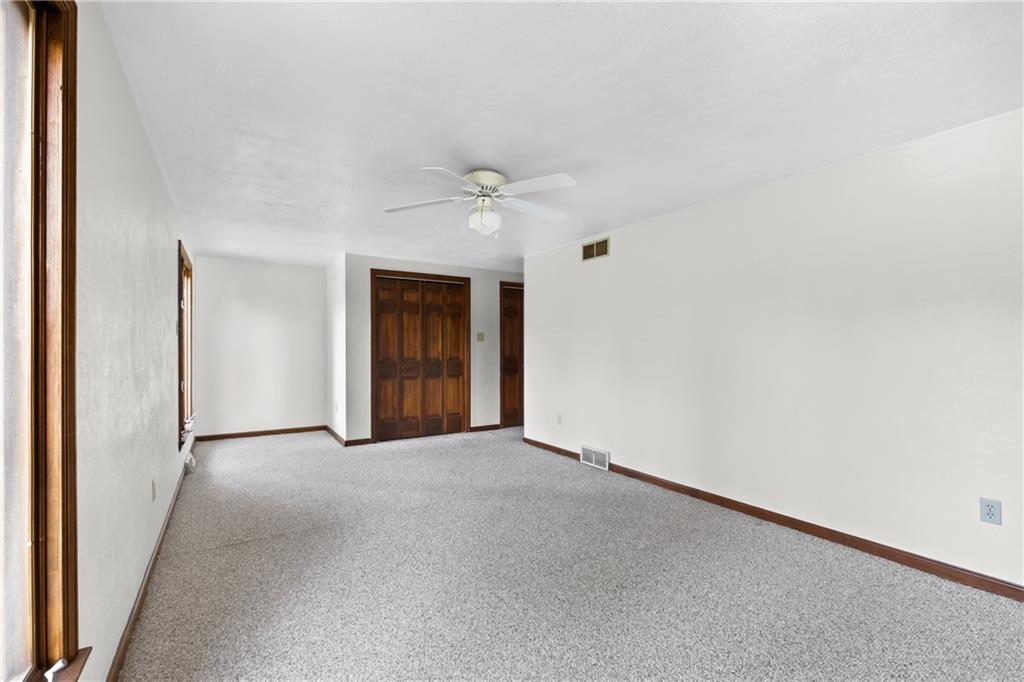 1003 Beacon Way Pittsburgh, PA 15241 - Photo 27 of 45 an empty room with a ceiling fan and a window