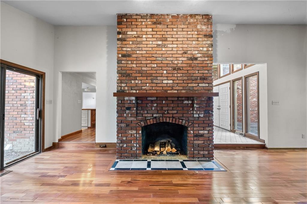 1003 Beacon Way Pittsburgh, PA 15241 - Photo 6 of 45 a living room with a fireplace and a wooden floor