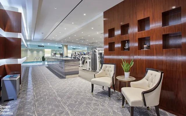 a bathroom with a granite countertop sink toilet a mirror a vanity and shower