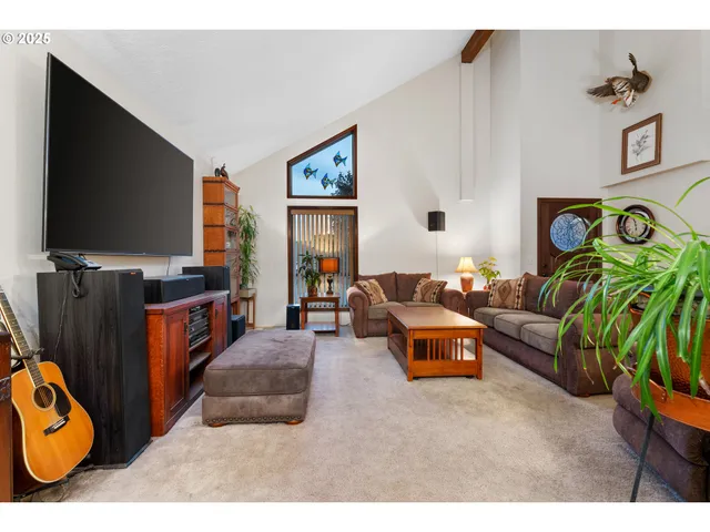 a bedroom with furniture and a potted plant