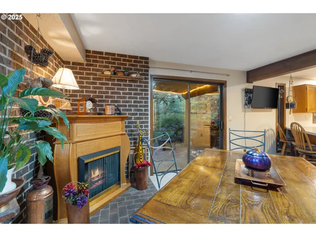 a living room with furniture and large windows