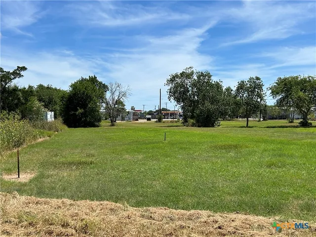 a view of a lake with a big yard
