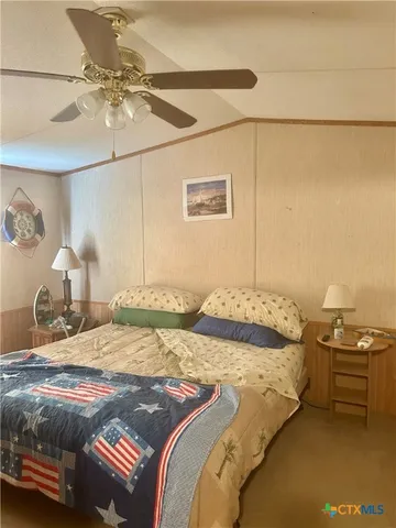 a bedroom with a bed and a cabinets